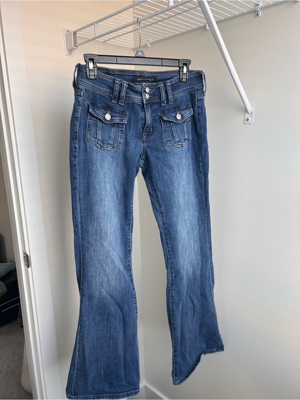 Low-Rise Dark Blue Flare Jeans with Front Flap Pockets